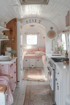 the interior of an rv with pink accents