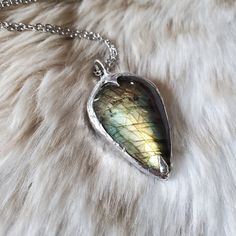 "With a distinctive Nordic vibe, this flashy labradorite is the perfect protective shield. Labradorite is a stone of protection and magick. This handmade beauty is crafted with silver, soft solder and finished in an antique silver patina and hangs from a 16\" chain with 2\" extender.  Your order will arrive gift boxed with care instructions included. Please let me know if you have any questions.  Thank you for looking.  Blessed be." Soft Solder Jewelry, Norse Shield, Soft Solder, Soldered Pendants, Blessed Be, Soldering Jewelry, Handmade Beauty Products, Soldering, Crystal Necklace