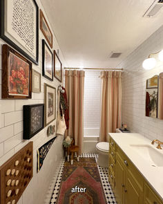 a bathroom with pictures on the wall and rug