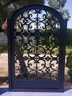 an iron gate in the shape of a tree