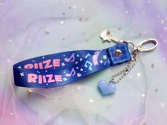 Express your passion for RIIZE with this stylish RIIZE Lanyard! Designed with the "Get a guitar" theme and featuring vibrant colors, this lanyard is the perfect accessory for any dedicated fans. Use it to hold your keys, ID badge, or even as a stylish addition to your everyday attire. Whether you're attending a concert, fan event, or just running errands, let everyone know you're a proud fan. LANYARD ✿ Lenght: +/- 18 cm ✿ Polyester ✿ Phone strap is included KEYCHAIN ✿ Lenght: +/- 10 cm ✿ Acrylic Event Lanyard Design, Kpop Lanyard, Lanyards Design, Anik Anik, Lanyard Keychain, Phone Strap, Kpop Merch, Id Badge, Badge Holders Lanyard