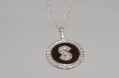 Beautiful 925 Sterling Silver Initial Letter S Pendant and 16" chain Necklace in the pictures enlarged to show detail 925 Sterling Silver Letter S Initial Pendant 925 Sterling Silver 16" Chain Rhodium Plated to help prevent tarnish Pendant features AAA Grade High Quality CZ Cubic Zirconia Stones Micropave Design Stones Handset micro cz stones set in pave pattern to create ultimate bling Pendant 14mm wide x 20mm high 20-SSN-INITDISC-SIL-S END inkFrog SmartCounters Personalized Silver Diamond Necklace With Cubic Zirconia, Personalized Silver Cubic Zirconia Diamond Necklace, Personalized Silver Round Diamond Necklace, Silver Diamond Necklace Si Clarity As Gift, Silver Diamond Necklace Si Clarity Gift, Silver Diamond Necklace With Si Clarity As Gift, Personalized Sterling Silver Diamond Pendant Necklace, Silver Sterling Initial Pendant Diamond Necklace, Sterling Silver Diamond Necklace With Pave Setting