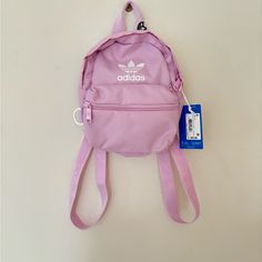 New With Tags Actual Color Is Orchid Fusion Purple But Looks More Of A Pink Shade :) Originally $35 Pink Adidas Backpack For Daily Use, Adidas Pink Backpack For Daily Use, Trendy Purple Bags For Back To School, Trendy Purple Back-to-school Bags, Pink Adidas Travel Backpack, Casual Purple Bags For Back To School, Purple Bag With Adjustable Strap For Back To School, Cute Purple Backpack With Adjustable Strap, Purple Back To School Bag With Adjustable Strap