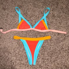 Colorblock Bikini. Size Small. Never Worn. Bikinis Color Block, Vibrant Blue Triangle Top Swimwear, Vibrant Orange Triangle Top Swimwear, Vibrant Orange Swimwear For The Beach, Vibrant Orange Swimwear For Beach, Color Block Triangle Top Swimwear For Beach Season, Color Block Triangle Top Swimwear For Sunbathing, Color Block Triangle Top Swimwear For Beachwear, Multicolor Color Block Swimwear For The Beach