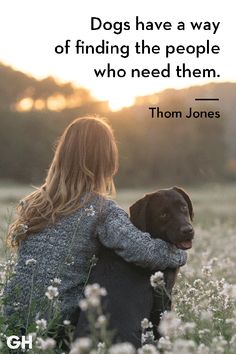 a woman sitting in a field with her dog and the quote dogs have a way of finding the people who need them