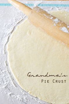 a pizza crust with a rolling pin on it and the words grandma's pie crust written in cursive writing