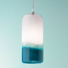 a blue and white light hanging from a ceiling