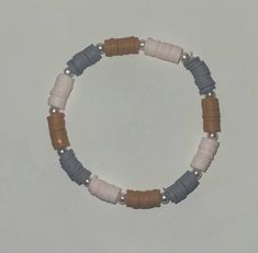 The Western Pink Bracelet has brown, gray, and very light pink beads with pearls in between. Western Heishi Bracelet, Western Clay Bracelet Ideas, Western Bracelet Ideas, Clay Bracelets Ideas Aesthetic, Western Clay Bead Bracelet, Make Clay Beads, Bracelet Business, Bracelet Stuff, Western Bracelets