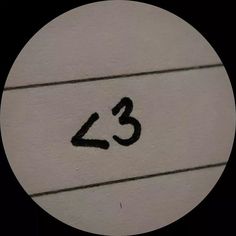 the number twenty three written in black on a white ball