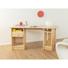 a wooden desk sitting on top of a hard wood floor