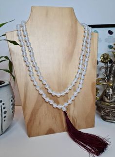 A handmade beautiful White Jade Stone Meditation Mala, Healing necklace, Prayer Beads in 8/10 mm size of beads with blue or maroon color silk tassel. White Jade is a gemstone that holds a lot of meaning and plenty of healing properties, mostly known in her ability to increase or enhance the energy of love in your life, healing, making one feeling peaceful and calm. White Jade is a kind of Tremolite Jade witch is a variety of Nephrite, that's usually white, off-white, or cream in color. The neckl White Spiritual Crystal Necklaces With Faceted Beads, White Spiritual Crystal Necklace With Faceted Beads, Adjustable White Mala With 8mm Beads, White Adjustable Mala With Gemstone Beads, Adjustable White Mala With Gemstone Beads, Adjustable White Gemstone Beads Mala, White 8mm Bohemian Beads, Bohemian White Crystal Necklaces With Round Beads, White Hand-strung Beaded Necklaces