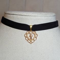 Gold Heart With Cross Gothic Style Velvet Choker Necklace. Charms Are Approximately 20x22mm. Comes On A 12 Inch Velvet Choker With A Lobster Clasp And 2 Inch Extension Chain. Black Heart Pendant Choker With Charm, Black Heart Choker Necklace Gift, Black Heart Pendant Choker With Heart Charm, Black Heart Choker Necklace For Gift, Gift Black Heart Choker Necklace, Elegant Black Heart Pendant Choker, Elegant Black Heart-shaped Choker, Elegant Black Valentine's Day Choker, Black Heart Charm Choker For Valentine's Day