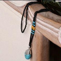 Bohemian Style Beaded Necklace With Turquoise Pendant. Ethnic Pendant Necklace. Seed Beads. Synthetic Stone. Black Necklaces With Large Beads For Beach, Blue And Black Beads Bohemian Necklace, Bohemian Black Beads Jewelry, Bohemian Blue And Black Beaded Necklaces, Turquoise Jewelry With Black Beads For Festival, Bohemian Long Necklace With Black Beads, Bohemian Black Turquoise Necklace As Gift, Bohemian Blue Necklace With Black Beads, Black Bohemian Turquoise Necklace As A Gift