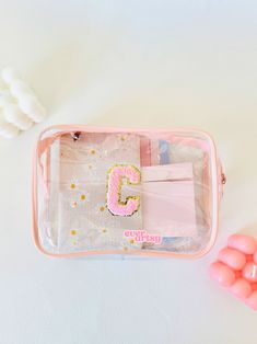 You've found the perfect custom name clear pouch! This Varsitiy letter bag is great for makeup bag, summer bag for beach, and organizer pouch. The chenille pouch makes the best gift for sisters, gift for wives, and gift for besties.  𝙋𝙡𝙚𝙖𝙨𝙚 𝙧𝙚𝙖𝙙 𝙩𝙝𝙚 𝙙𝙚𝙨𝙘𝙧𝙞𝙥𝙩𝙞𝙤𝙣 𝙗𝙚𝙛𝙤𝙧𝙚 𝙥𝙪𝙧𝙘𝙝𝙖𝙨𝙞𝙣𝙜.  🌟 𝐖𝐇𝐀𝐓'𝐒 𝐈𝐍𝐂𝐋𝐔𝐃𝐄𝐃 ✦ 1 clear pouch, customizable with chenille letters or pearl letters 🌟 𝐇𝐎𝐖 𝐓𝐎 𝐎𝐑𝐃𝐄𝐑 Step 1 Choose the patch color Step 2 Choose number Clear Zipper Pouch Cosmetic Bag, Trendy Rectangular Cosmetic And Toiletry Storage For Personal Use, Personalized Pouch Cosmetic Bag For Daily Use, Clear Zipper Pouch Cosmetic Bag For Personal Use, Personalized Pouch Cosmetic Bag, Personalized Cosmetic Pouch Bag, Clear Cosmetic Bag With Zipper For Personal Use, Clear Cosmetic Bag Pouch For Daily Use, Clear Cosmetic Pouch For Daily Use