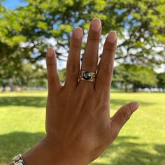 Stun with this classic Hawaiian Heirloom scrollwork ring with a sparkling diamond band and a gorgeous Tahitian black pearl at its crown. Crafted locally in Hawaiʻi, this piece represents "Everlasting Love." Perfect for anniversaries, engagements, or that special occasion. "Hawaiian Heirloom Scroll" Design Ring 14K Yellow Gold 10mm Tahitian Black Pearl (Black, Green, Grey and Peacock Overtones) Natural Diamond: 0.216 CTW 10mm Wide Band Contact us for additional ring sizes Locally Made in Hawaiʻi Black Pearl Ring, Tahitian Black Pearls, Scroll Design, Everlasting Love, Wide Bands, Black Pearl, Sparkle Diamonds, Tahiti, Pearl Ring