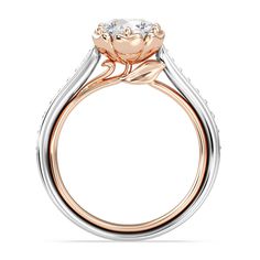 a rose shaped engagement ring with two tone gold and white diamonds