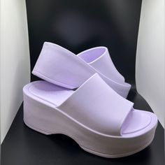 Vegan, Single-Band Jelly Platform Sandal. Comes In Orange, Black, Brown, Lilac, And White. Sizes 5-11m. Slip-On Platform Sandal Open Toe Approx. 2" Heel Approx. 1" Platform Synthetic Manmade Sole Unlined Padded Insole Purple Wedge Heel Sandals For Summer, Purple Wedge Sandals For Summer, Purple Wedge Sandals For Summer Beach, Purple Wedge Sandals For Beach In Summer, Purple Summer Wedge Sandals For Beach, Purple Summer Wedge Sandals, Summer Purple Wedge Sandals, Casual Purple Heels, Purple Wedge Heel Sandals In Synthetic Material