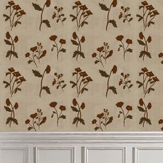 the wall paper has brown flowers on it