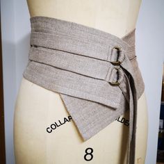 "Women's Wide Linen Obi Belt with Ties from the \"Desert Hues: Gender-Neutral Linen Collection.\"  This stylish accessory is designed to add a touch of bohemian flair and functional charm to your outfit. Crafted from natural flax linen, the wide obi belt embraces the authenticity of untouched fibers, offering a soft and comfortable feel against your waist. The ties allow you to customize the fit, providing both a fashion statement and a practical accessory. The earthy tones of natural flax linen bring the essence of the desert into your wardrobe, creating a seamless blend with the collection's gender-neutral aesthetic.  Pair it with a flowing dress or a loose-fitting tunic to accentuate your silhouette, or use it to add a boho touch to your favorite jeans and top. Our Women's Wide Linen Ob Linen Belt, Obi Style, Belt Corset, Obi Sash, Linen Collection, Blue Belt, Denim Belt, Linen Scarves, Obi Belt