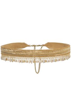 The noori waist belt gold is inspired by the textures and patterns found in legacy gold jewelry. Hand embellished with muted gold Japanese beads, luminous tubes, semi precious stones, iridescent crystals and pearls, the surface glimmers with opulence. Our signature tassels make it a statement accessory versatile enough to enhance any look. Adjustable Bohemian Gold Chain Belt, Adjustable Gold Bohemian Chain Belt, Elegant Gold Chain Belt For Festival, Adjustable Gold Choker For Celebration, Elegant Gold Choker For Festivals, Elegant Gold Choker For Festive Occasion, Bohemian Gold Chain Belt As A Gift, Bohemian Gold Chain Belt - Perfect Gift, Bohemian Gold Chain Belt Gift