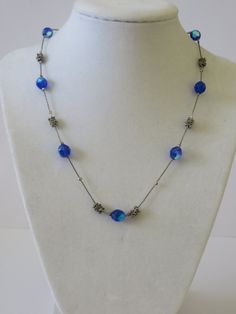 "Vintage Antique Silver Tone Blue Faceted Beaded Necklace. The necklace measures 18\" long. The necklace is in great vintage condition. Lobster clasp with extended chain. All items go through a detailed inspection and they are professionally cleaned prior to being released for sale and shipping. Once payment has cleared your item will be shipped immediately Organza Bag / Gift Box Included with Purchase Packed with extra care to avoid damages while shipping Thank you for shopping at The PJ Compan Elegant Blue Long Chain Necklace, Elegant Long Blue Chain Necklace, Elegant Blue Beaded Chain Necklace, Blue Long Single Strand Beaded Necklace, Blue Single Strand Long Beaded Necklace, Adjustable Blue Costume Jewelry Necklace, Blue Single Strand Formal Jewelry, Blue Single Strand Jewelry For Formal Occasions, Blue Costume Jewelry Necklaces With Lobster Clasp