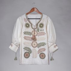 Luxury Floral Embroidery Button-up Blouse, Long Sleeve Tops With Floral Embroidery, Luxury Floral Embroidery Shirt With Spread Collar, Cheap Bohemian Shirt With Floral Embroidery, Cheap Floral Embroidery Blouse For Women, Cheap Embroidered Blouse Piece For Eid, Festive Blouse With Floral Embroidery, Luxury Relaxed Fit Blouse With Floral Embroidery, Luxury Embroidered Traditional Blouse