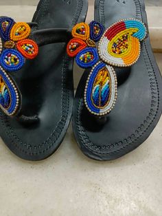 This African beaded Masai sandals are made from leather and beads which comes in different colours of ones choice. It can be customized in terms of size,pattern and colour. They can be worn at any given time, wether in weddings, parties, holidays at the beach and home. Note:This listing is for one pair,  but we do both wholesale and retail Leather And Beads, Beaded Leather Sandals, Sandals Gladiator, Beaded Shoes, Beaded Sandals, Sandals Leather, African Beads, Bead Leather, Size Pattern