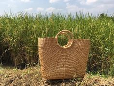 The  Picnic Basket Tote is natural seagrass in Thailand and weaved by Thai artisans This is a high quality woven bag with Tassel to use in a variety of ways, this can be a beach bag , summer bag. Straw Weave Handbag is 100% handcrafted by local Thailand artists, from a waterhyacinth. The work is exquisite and of a very high quality. the bags is created with love and hand worked, that makes it unique and one of a kind also a perfect bag or gift for a girl The picnic basket tote is one of our best Eco-friendly Beach Bag With Round Handle, Natural Bucket Straw Bag With Large Capacity, Eco-friendly Palm Leaf Bag With Open Weave, Large Capacity Natural Straw Bucket Bag, Natural Large Capacity Bucket Straw Bag, Natural Color Large Capacity Bucket Straw Bag, Eco-friendly Natural Straw Bag, Braided Jute Beach Bag In Natural Color, Natural Jute Braided Beach Bag