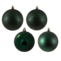 three green christmas ornaments on a white background