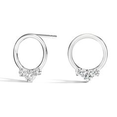 Nina Diamond Earrings . Chic and sophisticated, these earrings feature graduated prong-set diamonds in a row along the bottom edge of the front-facing hoop for an alluring everyday look. Timeless Cluster Earrings For Anniversary With Prong Setting, Modern Round Cut Halo Diamond Earrings, Timeless Cluster Earrings For Anniversary, Formal Round Cut Cluster Earrings With Lab Grown Diamonds, Classic White Gold Cluster Earrings With Single Cut Diamonds, Timeless Diamond Cluster Earrings With Brilliant Cut, Timeless Brilliant Cut Diamond Cluster Earrings, Timeless Cubic Zirconia Cluster Earrings For Anniversary, Timeless White Gold Cluster Earrings With Diamond Accents