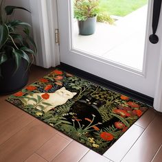 a door mat with an image of a cat and flowers on it in front of a doorway