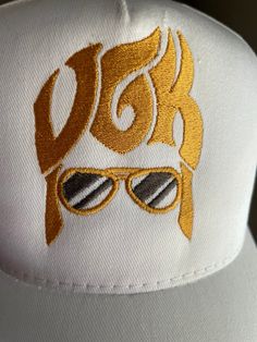 Quantities are limited so get them while available.  Vegas Golden Knights ELVIS hat/cap is finished in snapback style. Embroidered with commercial grade brilliant metallic threads Abailable in either Black, or White cap color. Please message me your color choice. Our unique embroidered designs are created with the utmost attention to details. They are NOT made in Mexico, or China they are proudly MADE IN AMERICA 🇺🇸 Summer Gold Trucker Hat, Gold Baseball Cap For Summer, Adjustable Gold Baseball Cap For Summer, Gold Adjustable Cap, Adjustable Gold Cap, Gold Adjustable Trucker Hat For Summer, Gold Baseball Cap For Streetwear, Gold Snapback Baseball Cap For Streetwear, Adjustable Gold Trucker Hat For Summer