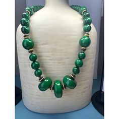 A vintage emerald-green beaded necklace is a striking piece of jewelry characterized by its vibrant, deep green beads. This necklace exudes an air of elegance and sophistication, with the rich green color evoking a sense of luxury. Size: Womens 26" Condition: New Without Tags Excellent Condition. Single Strand Emerald Necklace For Formal Occasions, Green Single Strand Necklace For Formal Occasions, Elegant Green Single Strand Necklace, Elegant Single Strand Green Emerald Necklace, Vintage Green Emerald Necklace For Formal Occasions, Classic Green Single Strand Necklace, Green Jade Emerald Necklace With Polished Beads, Green Emerald Necklace With Polished Jade Beads, Elegant Jade Jewelry With Large Beads