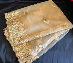 Very beautiful premium quality Dupatta embellished with golden beads on 2 sides and broad sequin cut work with embroidery on the other 2 sides for girls and women. Pair this Dupatta with your ethnic outfits. Finest quality net with golden color. This Dupatta compliments your attire. Length 2.50metres Gold Embroidered Unstitched Sharara, Unstitched Embroidered Gold Sharara, Festive Gold Embroidered Sharara, Gold Embroidered Sharara With Traditional Drape, Gold Sharara With Zari Work For Festivals, Gold Churidar With Resham Embroidery For Eid, Gold Embroidered Fabric With Gota Work In Traditional Drape, Traditional Drape Gold Embroidered Fabric With Gota Work, Gold Embroidered Fabric With Gota Work