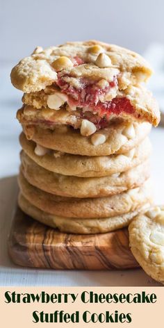 strawberry cheesecake stuffed cookies stacked on top of each other with the words, strawberry cheesecake stuffed cookies