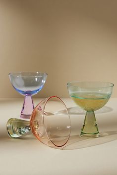 three glass bowls sitting on top of a table