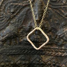 Hammered pattern square charm chain necklace is a decadent choice for women of all ages. Wear this cube charm necklace for a look that is all your own. It also makes a memorable gift idea for all occasions. - Open hammered square charm - choose from thin gold filled Or sterling silver chain 1.2mm - spring ring closure Necklace Minimalist Jewelry, Square Necklace, Minimalist Women, Charm Chain, Necklace Minimalist, Memorable Gifts, Sterling Silver Chain, Minimalist Jewelry, Spring Rings