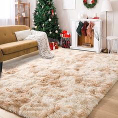 a living room filled with furniture and a christmas tree