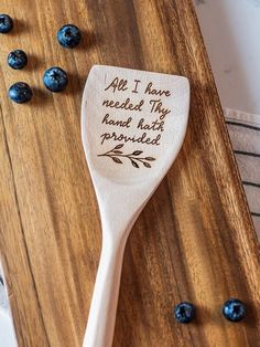 a wooden spoon with the words, all i have needed is hand - picked written on it