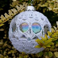 a crocheted ornament with sunglasses on it