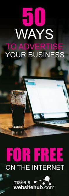 a laptop computer sitting on top of a wooden table next to a cup of coffee