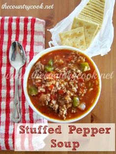 a bowl of stuffed pepper soup with crackers on the side