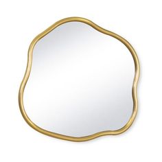 an oval mirror with gold frame on a white wall