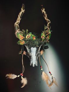 woodland spirit headdress Faux ram skull headdress with leaves and moss and white line in middle. Perfect for samhain festivals and pagan rituals! I N C L U D E D Masks come with thick black elastic band attached. S I Z E  Adult size. Detailed dimensions available upon request. C U S T O M I Z A T I O N If you would like to color & embellish the mask to match your costume/dress, choose custom color and get in touch, we love to work on custom orders!  C O N T A C T  Please contact us via ETSY messages. P H O T O  Images displayed on this listing are property of www.higginscreek.com A B O U T HigginsCreek makes elegant face Masks for masquerade balls, Prom Dances, Bachelorette parties, Graduation, costume Birthdays, Halloween, musical & theater productions, Mardi Gras celebration and Carniva Forest Headdress, Viking Headdress, Samhain Festival, Skull Headdress, Kids Party Packs, Elegant Face Mask, Thank You Wishes, Ram Skull, Pagan Rituals