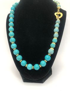 If you are looking for a one of a kind stunning piece of jewelry that will make you stand out from the crowd, look no further than this luxury turquoise and 14k gold necklace. This necklace features beautiful turquoise beads in two sizes, 8mm and 4mm, that are nestled between intricate gold findings. The turquoise beads contrast with the warm glow of the gold. The necklace is 22 inches long and has a heart of gold closure that adds a touch of romance and elegance. This necklace is not only gorgeous but also meaningful. Turquoise is a stone of protection, healing, and wisdom. It is said to bring good luck, happiness, and peace to the wearer. Gold is a symbol of wealth, power, and love. It is also associated with the sun, which represents life, energy, and creativity. Together, turquoise and Symbol Of Wealth, Happiness And Peace, Boho Chic Necklace, Life Energy, 14k Gold Necklace, Nature Jewelry, Feeling Special, Turquoise Beads, Heart Of Gold