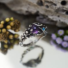 "Be transported to the heavenly fascinating world of Natural colorful gems with a new-in \"Ione\". Original match of purple Amethyst and Blue Apatite will make your eyes shine and boost your mood. Having in mind that every detail is handmade and the design is consciously elaborated by the master with more than 16 years of experience will leave a zero chance for you to forget about this ring. Wear the \"Ione\" as your daily accessory to show your authenticity or as your lovely engagement ring - i Luxury Handmade Spiritual Amethyst Ring, Purple Engagement Ring Silver, Amethyst Engagement Ring, Amethyst Ring Engagement, Ring Flower, Moonstone Engagement, Boost Your Mood, Gemstone Meanings, Family Jewellery