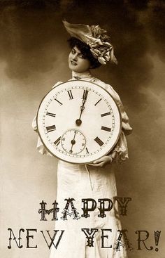 a woman holding a large clock with roman numerals on it's face