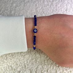 Protect yourself from negativity with our blue evil eye bead bracelet with gold balls and bring only positive vibes into your life. Since all of our Nazar protective bracelets with the popular Turkish eye are adjustable in size, they fit children, women and men and are therefore the perfect gift. What are the advantages of our 100% handmade blue protective amulet? ❤️ Unique Hamsa or Boncuk design. ❤️ Uniquely braided and therefore suitable for every wrist. ❤️ Many color variations and therefore Gold Evil Eye Bracelet With Letter And Round Beads, Healing Beaded Evil Eye Bracelet With Round Beads, Healing Beaded Evil Eye Bracelet, Healing Evil Eye Beaded Bracelet, Spiritual Round Beaded Bracelets With Evil Eye, Spiritual Evil Eye Beaded Bracelets, Blue Spiritual Bracelets With Letter Beads, Casual Blue Friendship Bracelets With Evil Eye, Blue Friendship Bracelets With 8mm Beads