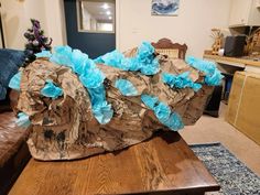 a large piece of paper sitting on top of a wooden table in a living room