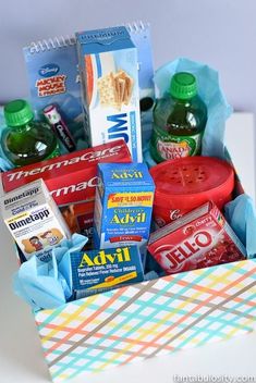 a box filled with snacks and condiments sitting on top of a white table